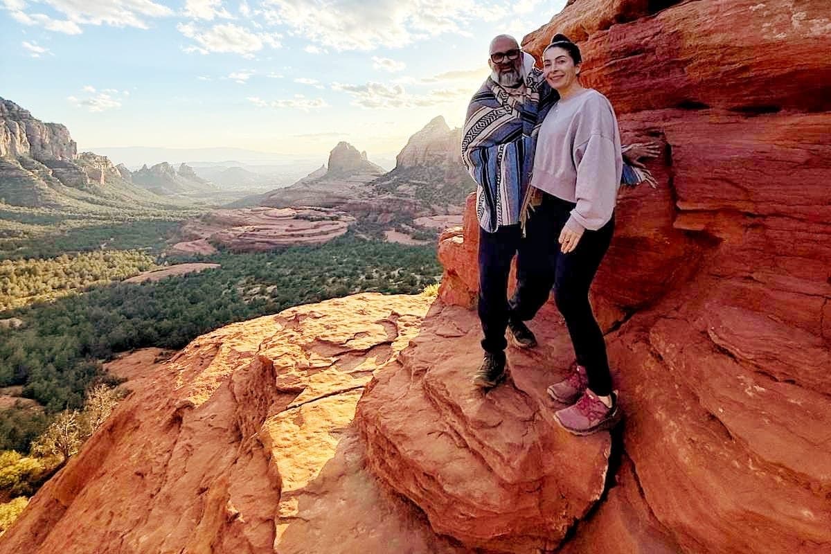 Jennifer Spencer and Steve Fernandez on the red rocks above the Sedona valley