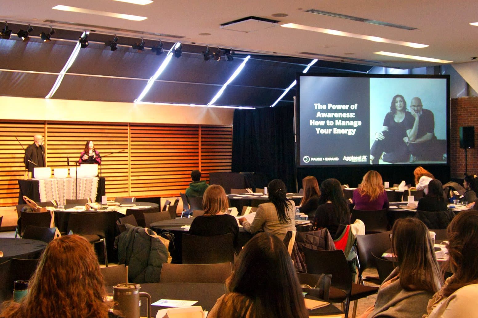 Jennifer Spencer and Steve Fernandez presenting to a corporate audience