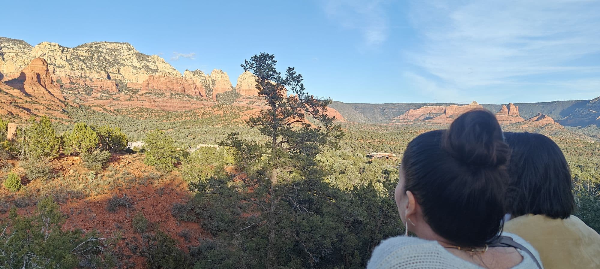 Two guests looking out over the red rocks together